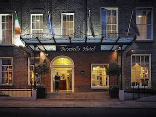 this image is a shoot in front of Buswells 3 star hotel in Dublin at night.